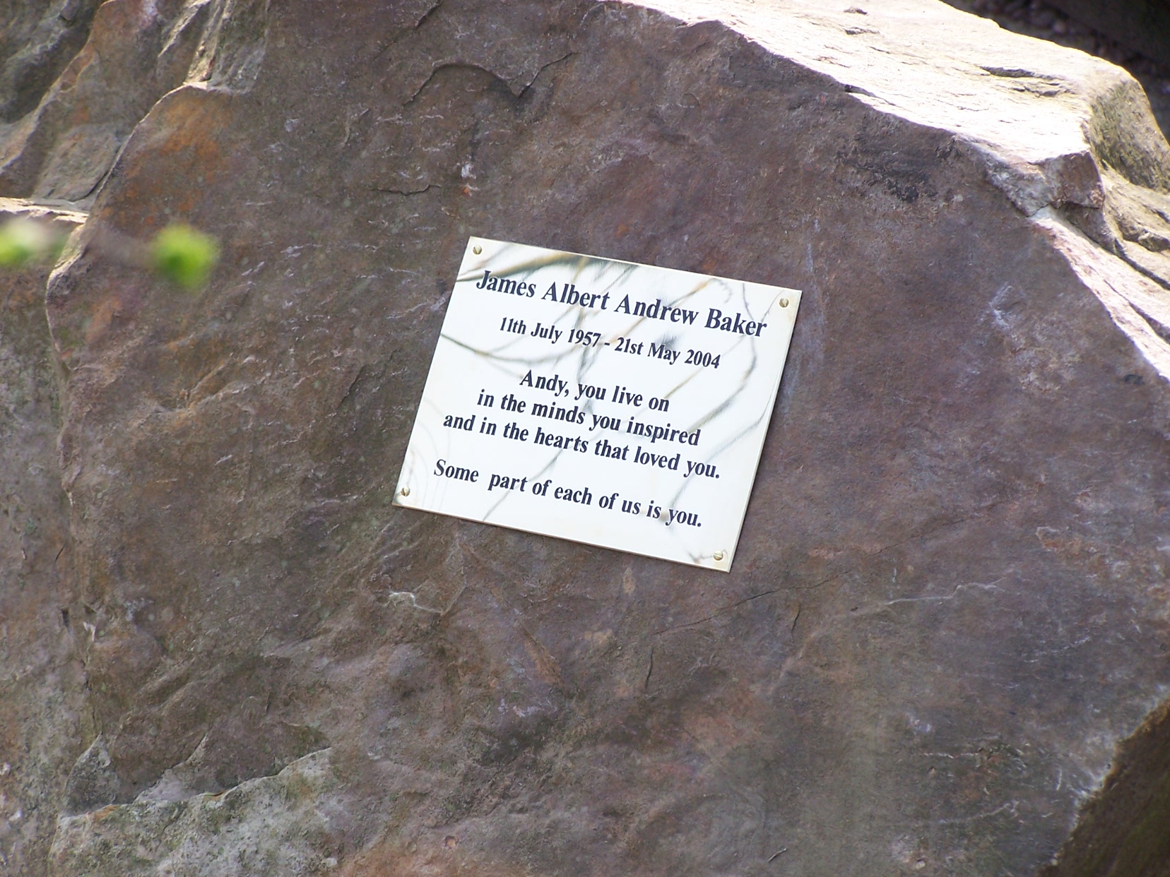 Brass memorial plaque fixed to the boulder