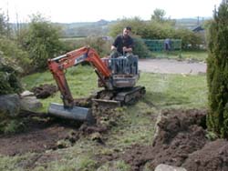 Starting to remove the grass and top soil with mini digger