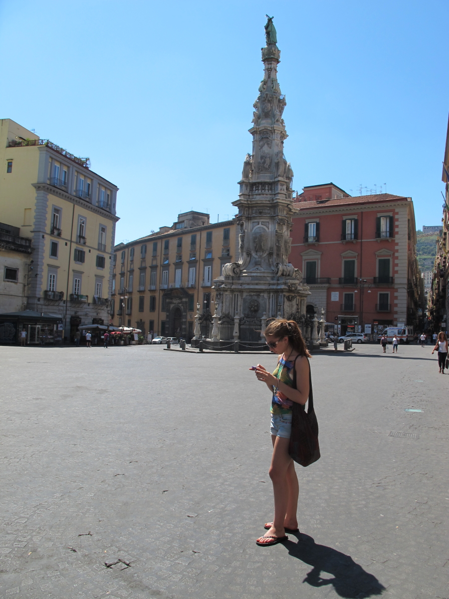 looking at phone in piazza del Gesu nuovo