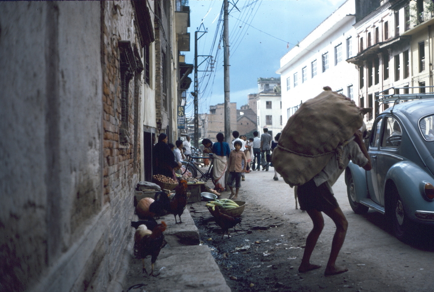 Porter carrying large load on his back