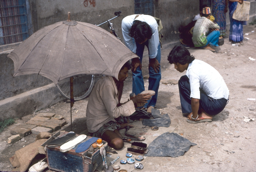 Cobbler working at road side