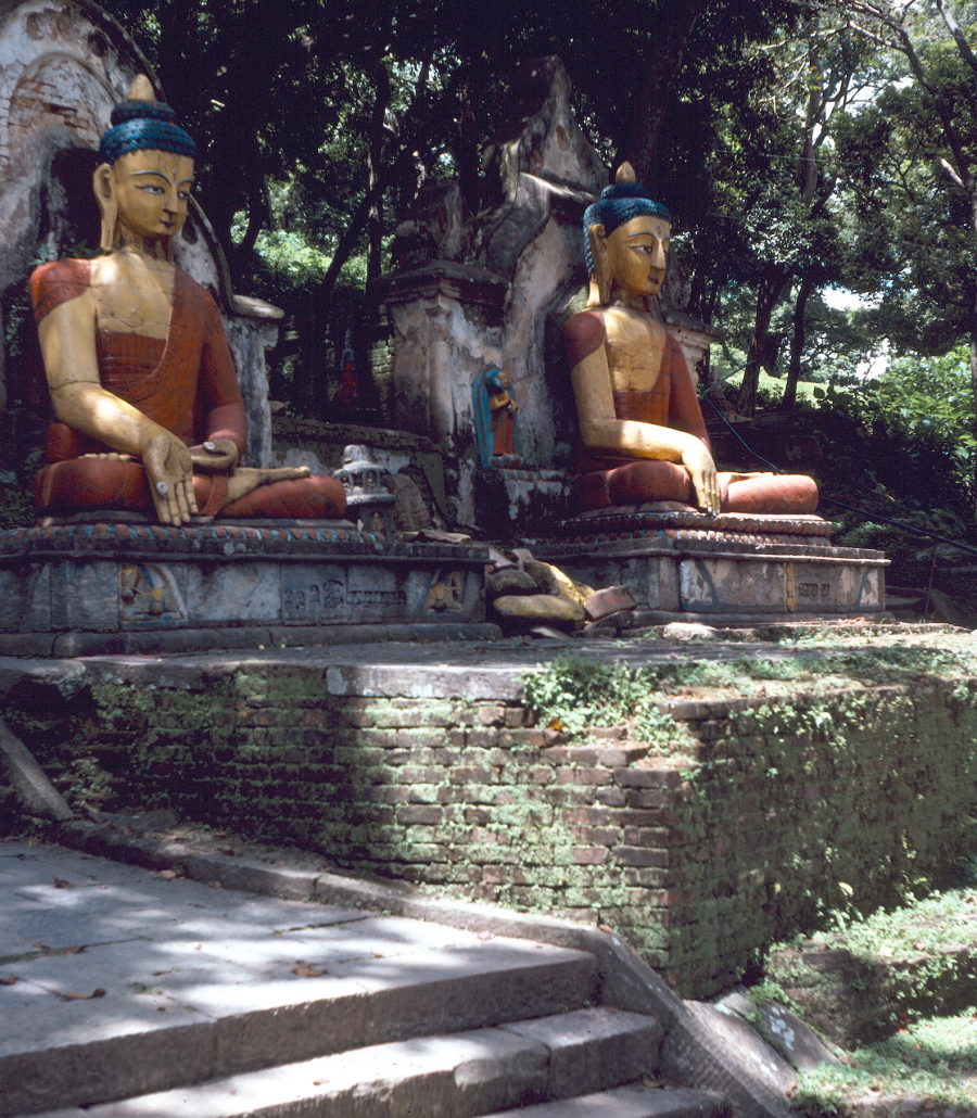 Statues of buddhist monks at the entrance to the temple