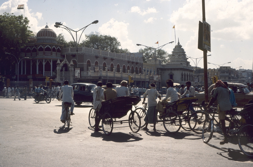 Road junction with bicycles and bicycle-rickshaws waiting to turn