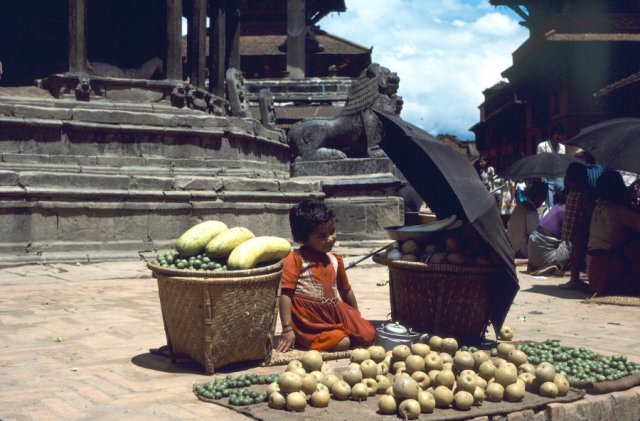 Young child minding vegetable stall in Patan