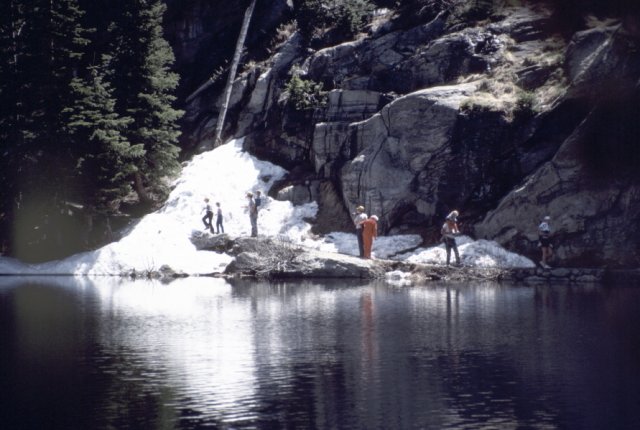 Family in snow at edge of Bear Lake in the Rocky Mountain National Park