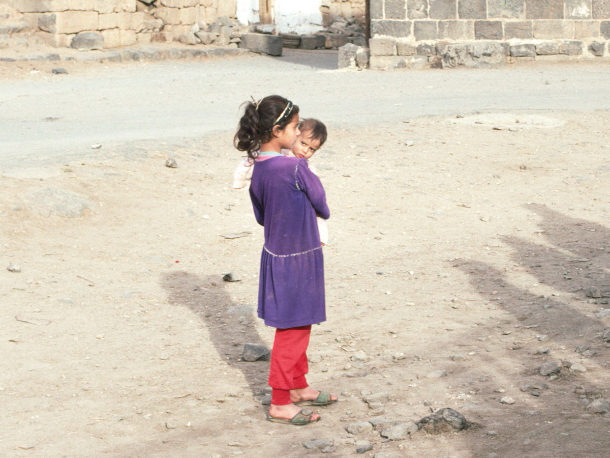 Child and baby in Bosra