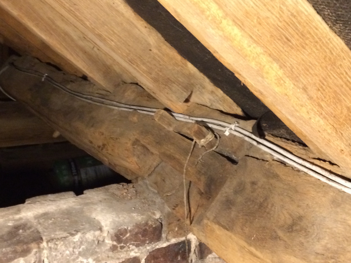 wooden roof beams in loft