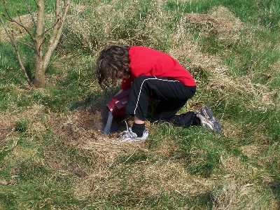 Louise burying Andy's ashes